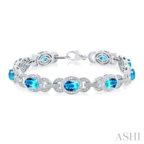 1/10 ctw Oval Shape 7x5 MM Blue Topaz and Round Cut Diamond Semi Precious Bracelet in Sterling Silver