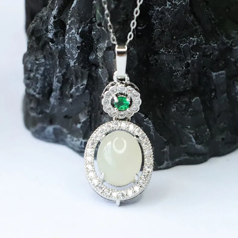 Oval White Jade Pendant with Zircon Halo in Sterling Silver