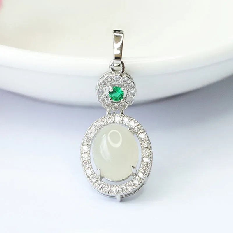 Oval White Jade Pendant with Zircon Halo in Sterling Silver