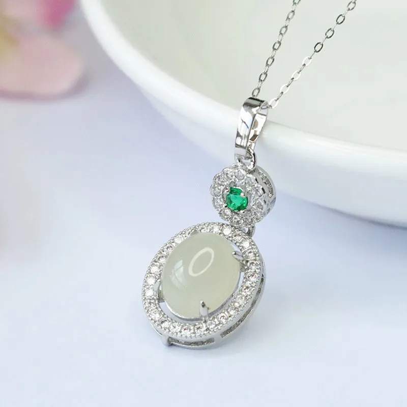 Oval White Jade Pendant with Zircon Halo in Sterling Silver